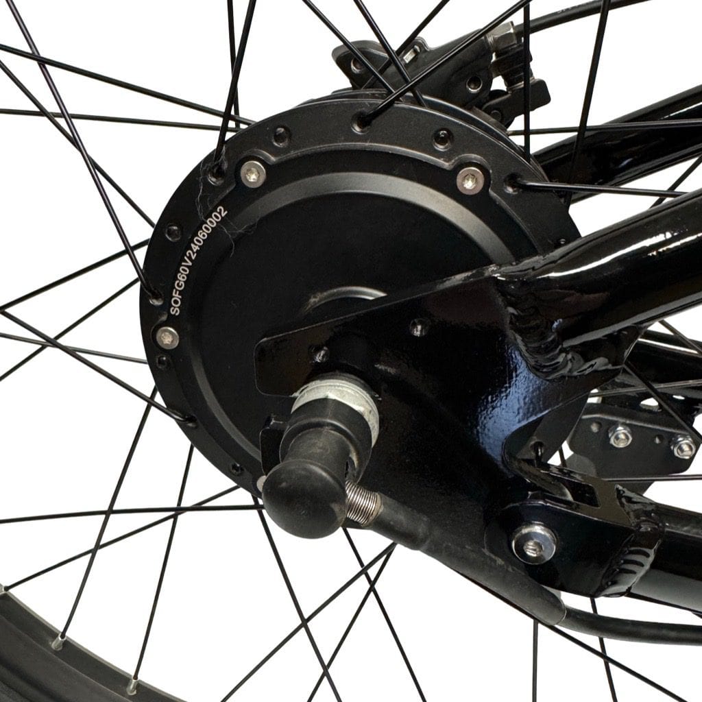 Close-up of electric bike rear hub motor and spoked wheel assembly